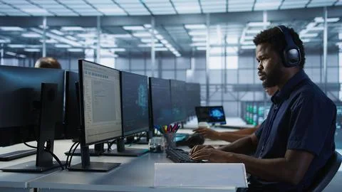 Worker reading paperwork in data center, using analytics 스톡 사진