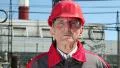 Worker in red hard hat at nuclear power plant looking at the camera HD Footage