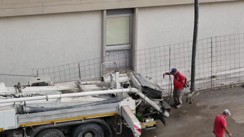 A worker in a red shirt cleans the mechanical vehicle Video stock 243600751