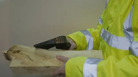 Worker In Reflective Uniform With An Ax Stock-Footage 220016827