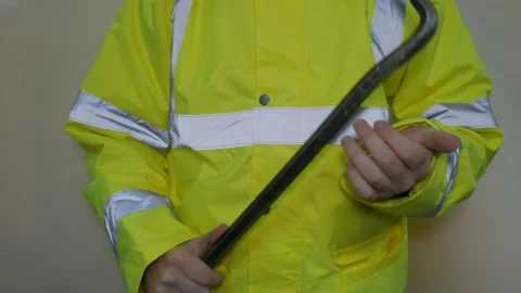 Worker In Reflective Uniform With Crowbar Stock-Footage 220016854