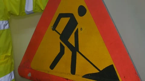 Worker In Reflective Uniform With Road Sign 库存影片 220016849