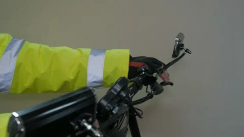 Worker in reflective uniform on scooter Stock Footage 220433270