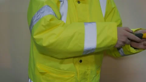 Worker In Reflective Uniform With Screwdriver Stock-Footage 220016799