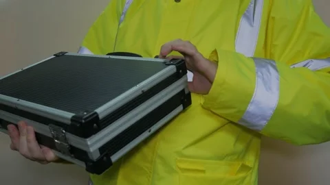 Worker In Reflective Uniform With Suitcase Stock Footage 220016866