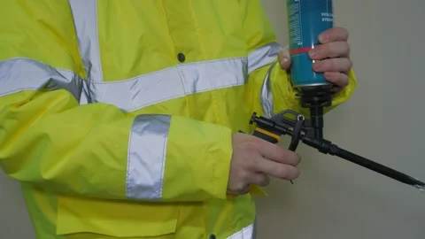 A worker in a reflective uniform works Stock Footage 220433346