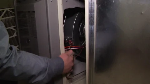 Worker removes filter and cleans inside of panel Stock Footage 42966005