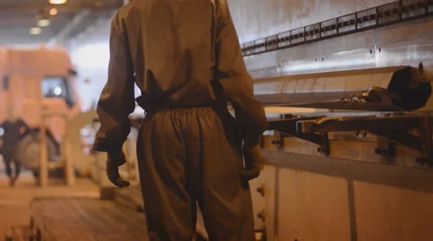 Worker removes the product from the machine large bending sheet metal Stock Footage 57513381