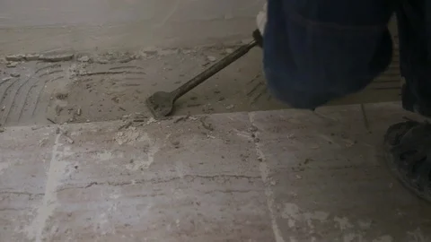 Worker removing old tile from the floor ... | Stock Video | Pond5