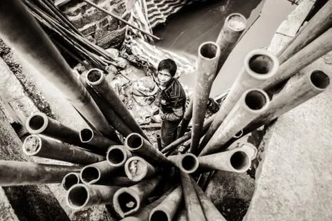 Worker Removing Pipes in River on a Construction Site Stock Photos