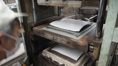 Worker Removing Pressed Rubber Sheet Then Pan to Press Cabinet Vídeo Stock 339736609
