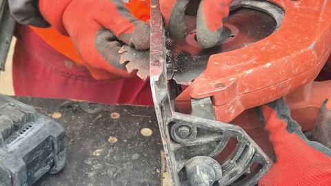 Worker Removing Worn Circular Saw Blade with Wrench Stock Footage 338226962