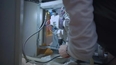 Worker repair dishwasher in the kitchen. Stock Footage 250440987