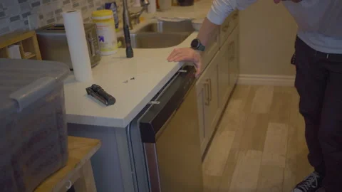 Worker repair dishwasher in the kitchen. Stock Footage 252231563