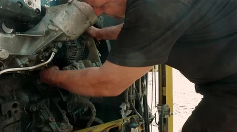 Worker repairing Engine of Harvester close up view. Stock Footage 67487963