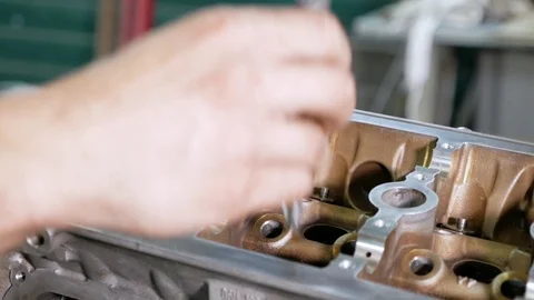 Worker repairing the engine to the service centre. Close up of technician 库存影片 121280983