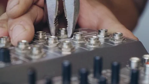 A worker repairs an audio mixer close up Stock Footage 126394223