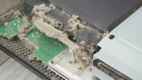 Worker repairs a game console in which a lot of dust Stock Footage 108521165
