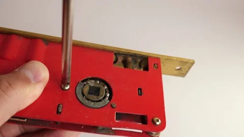 A worker repairs an interior door lock. Housework concept. 動画素材 201735941