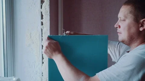 Worker repairs a window Stock Footage 81502224