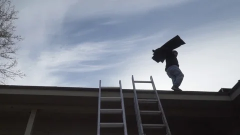 Worker Replacing Shingles - Residential Roof Repair Stock Footage