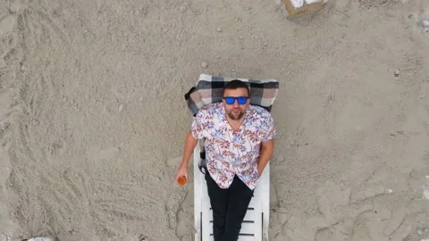 The worker rested in the winter on the construction site lying on a deck chair Stock Footage 145874760