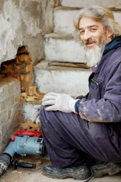 Worker resting after work at construction site Stock Photos