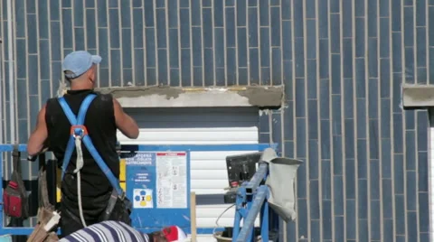 Worker restore window sill, on an elevator Stock Footage 49454546
