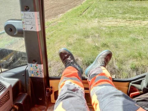 The worker rests his legs during a break at work Stock Photos