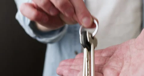 Worker returns bunch of apartment keys to houseowner Video stock 302030711