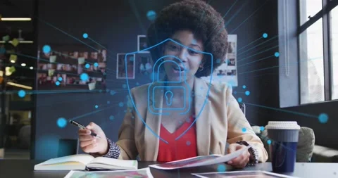 Worker reviewing papers while flipping notebook, blue dots forming security lock Stock Footage 328655679