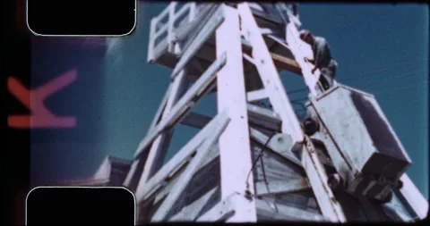 Worker rides ore skip car down derrick, pre-OSHA, 1943 Stock Footage 194343618