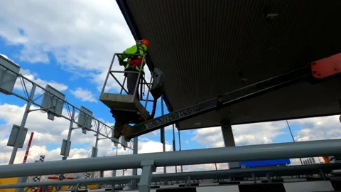 The worker rises to perform the installation at a height of. Stock Footage 152834402