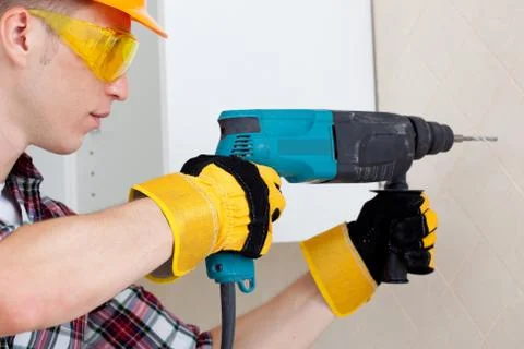Worker with rock-drill Stock Photos
