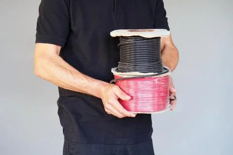 Worker with rolls of the cable Stock Photos