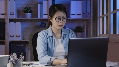 Worker rubbing eyes while sitting in front laptop Stock Footage 101673267