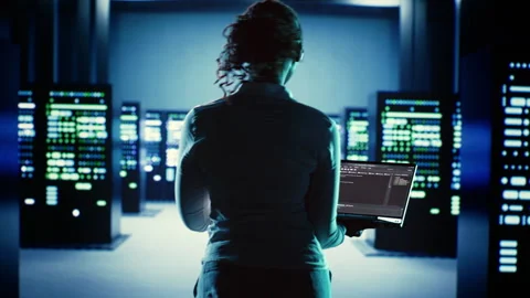 Worker runs code in data center Stock Footage 249565157