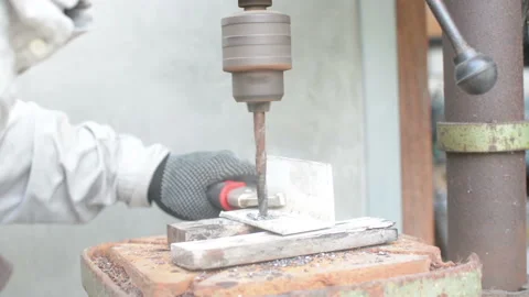Worker' s hands using drill on steel Stock Footage 201883246