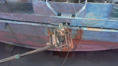 The worker sand-sprinkler processes a ship board. Stock Footage 165030427
