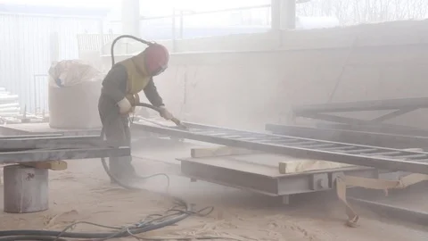 Worker sandblasting metal Stock Footage 76281353