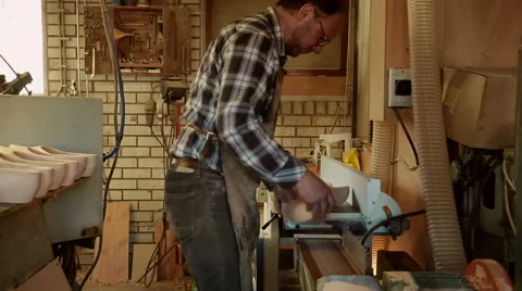Worker is sanding the bottom of a Clog [Slomo] Stock Footage 47002462