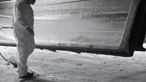 Worker sanding down a boat's frame 2 Stock Footage 162345718