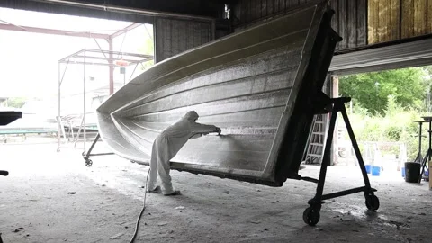 Worker sanding down a boat's frame 1 Stock Footage 162345721