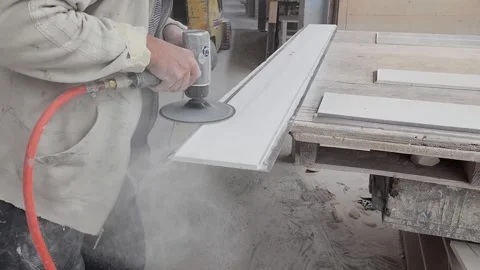 Worker Sanding Fabricated Panel with Pneumatic Power Tool Stock Footage 346788292