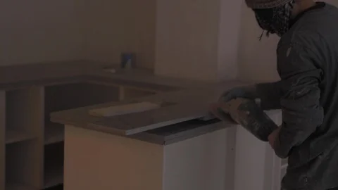 Worker sanding marble in building site with sander. Grinding surface. Video stock 110771528