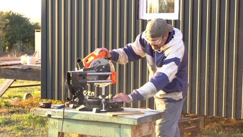 A worker is sawing a board 4K Stock Footage 294047329