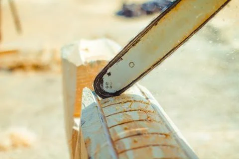 Worker sawing a chainsaw tree Stock Photos