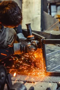 Worker sawing the iron Stock Photos