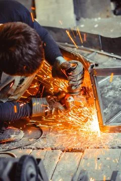Worker sawing the iron Stock Photos