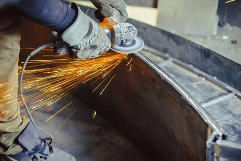 Worker sawing the iron Stock Photos